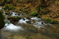 Tiny river called Schwarze Ernz near the waterfall Schiessentuempel in Luxembourg Royalty Free Stock Photo
