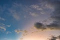 Tiny sliver moon in a sky just after sunset.