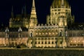 Tiny tank sculpture on the wall by the Danube river, Parliament building in the background, Budapest, Hungary