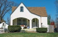 Tiny Unique White Stucco House with Arches and Pointed Roof