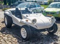 Tiny VW Beach Buggy parked