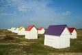 The tiny white beach cottages with colorful roofs Royalty Free Stock Photo