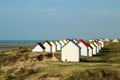The tiny white beach cottages with colorful roofs Royalty Free Stock Photo