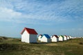 The tiny white beach cottages with colorful roofs Royalty Free Stock Photo