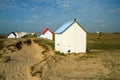 The tiny white beach cottages with colorful roofs Royalty Free Stock Photo