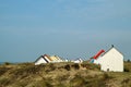 The tiny white beach cottages with colorful roofs Royalty Free Stock Photo