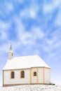 Tiny winter church or single snowbound small chapel