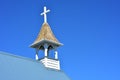 Tiny wooden belfry of small village church