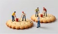Tiny workers build on a giant cookie in an imaginative scene of construction fun Royalty Free Stock Photo