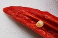 The tip of a hot red chili, sliced. Guts and seeds. Macro. Selective focusing