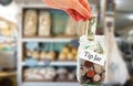 Tip jar money in a restaurant Royalty Free Stock Photo