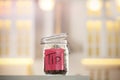 Tip jar with money against blurred background Royalty Free Stock Photo