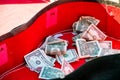 Tip money in guitar case Royalty Free Stock Photo