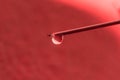 On the tip of a needle from a syringe drop of liquid Royalty Free Stock Photo