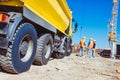 tip truck and construction workers Royalty Free Stock Photo