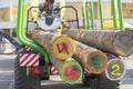 Tip truck transportation of sawn timber. The truck transports logs, on the road. Cut logs are loaded on a truck. Large truck Royalty Free Stock Photo