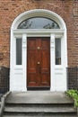 A tipical brownwooden door in Dublin of a victorian house