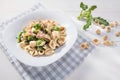 Tipical dish of Apulia region pasta Orecchiette with turnip greens and salted anchovies, top view, white wooden background