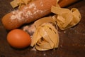 Tipical italian pasta pappardelle freh food homemade with eggs on table and kitchen utensils