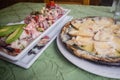 Tipical raw fish dish, ceviche. With vegetables, onion, red and