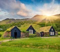 Tipical view of Icelandic turf-top  houses. Wonderful summer sunrise in the Skogar village, south Iceland, Europe. Beauty of Royalty Free Stock Photo