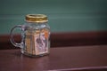 Tipping in a glass jar on a bar counter top