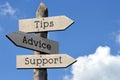 Tips, advice, support - wooden signpost with three arrows Royalty Free Stock Photo