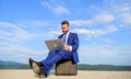 Tips create amazing cold emails. Businessman surfing internet or reply emails while sit with laptop outdoors. Sales Royalty Free Stock Photo