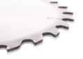 Tips of the teeth of a new ripping saw blade on a white
