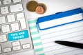 Tips And Tricks. Computer keyboard on a white office desk with various items Royalty Free Stock Photo