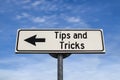 Tips and tricks road sign, arrow on blue sky background Royalty Free Stock Photo
