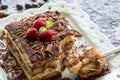 Tiramisu Cake with Grated Chocolate, Raspberry and Mint. Perfect Dessert. Royalty Free Stock Photo