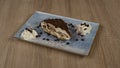 Tiramisu with chocolate beans on a plate