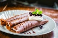 Tiramisu Pancakes with cream and berries, sweet, watering chocolate