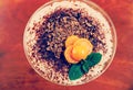 Tiramisu with physalis and mint, toned