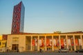 TIRANA, ALBANIA: Tirana Marriott Hotel and Arena Center skyscraper with red decorative elements and wall of glass.