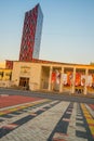 TIRANA, ALBANIA: Tirana Marriott Hotel and Arena Center skyscraper with red decorative elements and wall of glass.