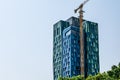 Construction crane near the modern Forever Green Tower skyscraper in Tirana. Contemporary Royalty Free Stock Photo