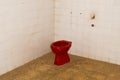 TIRANA, ALBANIA: Red toilet bowl in the interior of a military bunker, now the Bunker Art Museum.