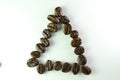 Tirangel form  Coffee beans in white background Royalty Free Stock Photo