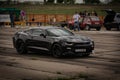 Tiraspol, Moldova - May 11, 2019: Chevrolet Camaro SS - participates in drag racing cars, warming up Royalty Free Stock Photo