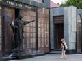 TIRASPOL, TRANSNITRIA - AUGUST 12, 2016: Old woman and her granddaughter mourning in front of a monument