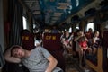 TIRASPOL, TRANSNITRIA MOLDOVA - AUGUST 13, 2016: Young man sleeping in a passenger car of the Chisinau-Odessa
