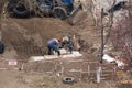 Tiraspol, Unrecognized Republic of Transnistria - November 18, 2021 A team of workers carries out repair work on a heating network