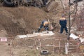 Tiraspol, Unrecognized Republic of Transnistria - November 18, 2021 A team of workers carries out repair work on a heating network