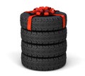 Tire as a gift. Set of three tires, one tied with a red gift ribbon with a bow. isolated on white background. 3d render