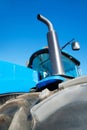 Tire on blue tractor close up Royalty Free Stock Photo