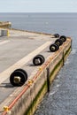 Tire Bumpers Along Concrete Pier