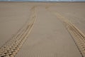 Tire car Tracks in the Beach Sand desert coast Royalty Free Stock Photo