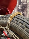 Tire chain on motorcycle wheel Royalty Free Stock Photo